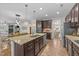 A Kitchen island provides space for food preparation and seating at 108 Yosemite Ct, Holly Springs, NC 27540