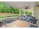 Inviting covered patio with ample seating and a view of the landscaped backyard, perfect for outdoor living at 108 Yosemite Ct, Holly Springs, NC 27540