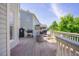 Outdoor deck featuring grilling station, fire pit, and seating, perfect for entertaining at 1097 Trentini Ave, Wake Forest, NC 27587