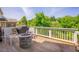 Outdoor deck featuring grilling station, fire pit, and seating, perfect for entertaining at 1097 Trentini Ave, Wake Forest, NC 27587