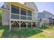 Spacious backyard features a deck, screened porch, and a playful swing set at 1097 Trentini Ave, Wake Forest, NC 27587