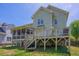 Spacious backyard features a deck, screened porch, and a playful swing set at 1097 Trentini Ave, Wake Forest, NC 27587