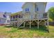 Spacious backyard features a deck, screened porch, and a playful swing set at 1097 Trentini Ave, Wake Forest, NC 27587