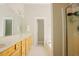 Bright bathroom with double vanity, soaking tub, and glass-enclosed shower at 1097 Trentini Ave, Wake Forest, NC 27587