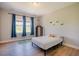 Bedroom with natural light, wood floors, and neutral decor at 1097 Trentini Ave, Wake Forest, NC 27587