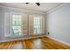 Bright bedroom with hardwood floors, shuttered windows and a relaxing atmosphere at 1097 Trentini Ave, Wake Forest, NC 27587
