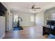 Spacious bonus room with wood floors, ceiling fan, workout equipment, and large windows at 1097 Trentini Ave, Wake Forest, NC 27587