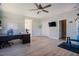 Spacious bonus room with wood floors, ceiling fan, workout equipment, and large windows at 1097 Trentini Ave, Wake Forest, NC 27587