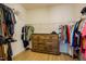 Walk-in closet with hanging racks, shelving, and a dresser at 1097 Trentini Ave, Wake Forest, NC 27587