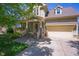 Charming home featuring a well-maintained front yard, covered porch, and attached two-car garage at 1097 Trentini Ave, Wake Forest, NC 27587