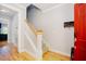 Inviting foyer with hardwood floors, staircase, and red front door at 1097 Trentini Ave, Wake Forest, NC 27587
