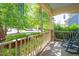 Cozy front porch adorned with colorful flowers and comfortable seating, creating a warm and inviting ambiance at 1097 Trentini Ave, Wake Forest, NC 27587
