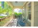 Relaxing front porch with comfortable rocking chairs and hanging planters, perfect for enjoying the outdoors at 1097 Trentini Ave, Wake Forest, NC 27587