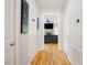 Hallway with natural light, hardwood floors, and neutral walls, offering a clean and versatile space at 1097 Trentini Ave, Wake Forest, NC 27587