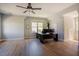 Bright office space with wood floors, ceiling fan, large desk, and a wall of windows at 1097 Trentini Ave, Wake Forest, NC 27587