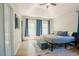 Spacious main bedroom with tray ceiling, wood floors, and windows at 1097 Trentini Ave, Wake Forest, NC 27587
