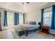 Spacious main bedroom with tray ceiling, wood floors, and natural light at 1097 Trentini Ave, Wake Forest, NC 27587