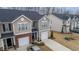 Overhead view of the property showcasing the townhome's layout, driveway, and surrounding neighborhood at 1109 Banworth Ct, Mebane, NC 27302