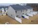 Aerial view of a fenced backyard with a small patio area perfect for relaxing at 1109 Banworth Ct, Mebane, NC 27302