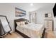 A cozy bedroom features neutral tones, a large bed, soft lighting and decorative accents at 1109 Banworth Ct, Mebane, NC 27302