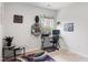 Bright office with a desk setup, decorative shelving, potted plants, and a calm atmosphere at 1109 Banworth Ct, Mebane, NC 27302