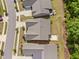 Overhead view of several homes in a suburban neighborhood with tree lined yards at 1129 Santa Cruz St, Wake Forest, NC 27587
