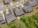 Overhead view of several homes in a suburban neighborhood with tree lined yards at 1129 Santa Cruz St, Wake Forest, NC 27587