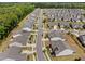 Neighborhood aerial showing multiple homes and long street at 1129 Santa Cruz St, Wake Forest, NC 27587