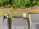 Birds eye view of three homes with a patio set and green grass in the backyard at 1129 Santa Cruz St, Wake Forest, NC 27587