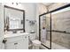 Updated bathroom featuring a vanity with a white countertop and a tiled shower at 1129 Santa Cruz St, Wake Forest, NC 27587