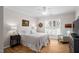 Bedroom featuring hardwood floors, large shuttered windows, and neutral walls at 1129 Santa Cruz St, Wake Forest, NC 27587