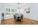 Breakfast area boasts natural light from the large windows and includes stylish lighting and a decorative painting at 1129 Santa Cruz St, Wake Forest, NC 27587