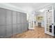Hallway featuring large gray cabinets and an opened doorway leading to another room at 1129 Santa Cruz St, Wake Forest, NC 27587