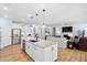 Bright, open kitchen with granite counters, stainless appliances, and seamless flow into the living area at 1129 Santa Cruz St, Wake Forest, NC 27587