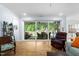 Cozy living room leads to a screened in porch with views to the backyard at 1129 Santa Cruz St, Wake Forest, NC 27587