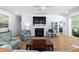 Cozy living room features a fireplace, hardwood floors, and ample natural light at 1129 Santa Cruz St, Wake Forest, NC 27587
