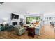 Bright living room with fireplace, large windows and beautiful outdoor views at 1129 Santa Cruz St, Wake Forest, NC 27587