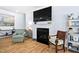 Cozy living room features a fireplace and hardwood floors at 1129 Santa Cruz St, Wake Forest, NC 27587