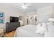 Bright main bedroom features a large television, and white walls with white trim at 1129 Santa Cruz St, Wake Forest, NC 27587