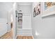 Inviting mudroom featuring a built-in bench, storage cubbies, and coat hooks, complemented by stylish decor at 1129 Santa Cruz St, Wake Forest, NC 27587