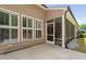 Relaxing patio area with a screened-in porch, offering a perfect blend of indoor-outdoor living at 1129 Santa Cruz St, Wake Forest, NC 27587