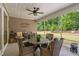 Cozy screened porch with comfortable seating overlooking a beautifully landscaped yard at 1129 Santa Cruz St, Wake Forest, NC 27587