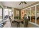 Screened porch with outdoor seating is perfect for relaxing and enjoying views of the backyard at 1129 Santa Cruz St, Wake Forest, NC 27587