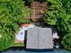 Aerial view of the backyard showcases the pergola, patio, firepit, and lush landscaping at 1141 Brookhill Way, Cary, NC 27519