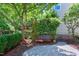Serene backyard features a charming bench and a beautiful garden area, perfect for relaxing at 1141 Brookhill Way, Cary, NC 27519