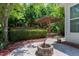 Great backyard has an awesome patio with a firepit and pergola, surrounded by beautiful landscaping at 1141 Brookhill Way, Cary, NC 27519