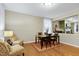 Cozy dining area with hardwood floors and natural light, creating a comfortable space for meals and conversation at 1141 Brookhill Way, Cary, NC 27519
