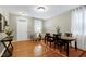 Spacious dining room with hardwood floors and ample seating, ideal for hosting gatherings and creating memories at 1141 Brookhill Way, Cary, NC 27519