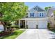 Beautiful two-story home with a two car garage and a well-manicured lawn, perfect for families at 1141 Brookhill Way, Cary, NC 27519