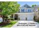 Charming two-story home with a two-car garage, beautiful landscaping, and a welcoming front porch in a residential neighborhood at 1141 Brookhill Way, Cary, NC 27519